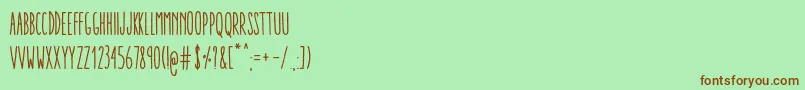フォントAracneUltraCondensedRegular – 緑の背景に茶色のフォント