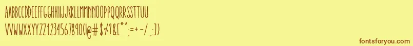 AracneUltraCondensedRegular-fontti – ruskeat fontit keltaisella taustalla