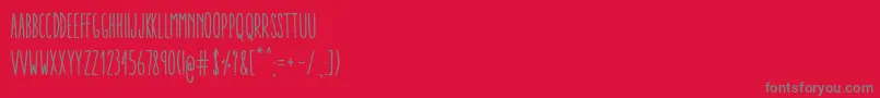 Czcionka AracneUltraCondensedRegular – szare czcionki na czerwonym tle