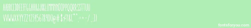 フォントAracneUltraCondensedRegular – 緑の背景に白い文字