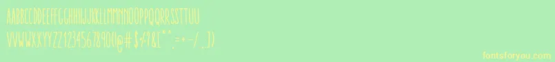 Czcionka AracneUltraCondensedRegular – żółte czcionki na zielonym tle