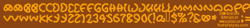 Prets Font – Orange Fonts on Brown Background