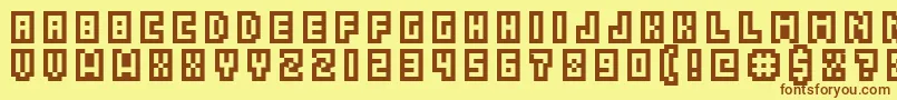 フォントGrixelAcme5CompcapsoXtnd – 茶色の文字が黄色の背景にあります。