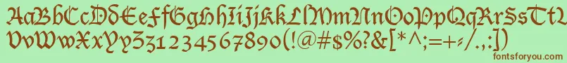 フォントLutherRegular – 緑の背景に茶色のフォント