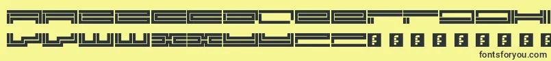 Trackmanic Font – Black Fonts on Yellow Background