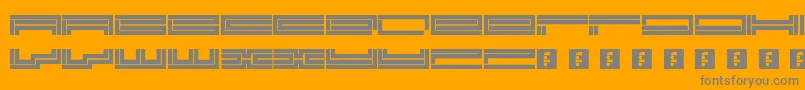 Trackmanic Font – Gray Fonts on Orange Background