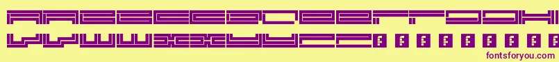 Trackmanic Font – Purple Fonts on Yellow Background