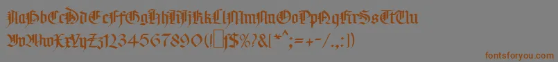 フォントMaGotic – 茶色の文字が灰色の背景にあります。