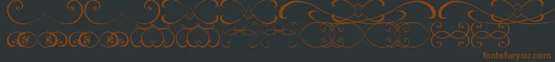 OrnamentsssTfb-fontti – ruskeat fontit mustalla taustalla