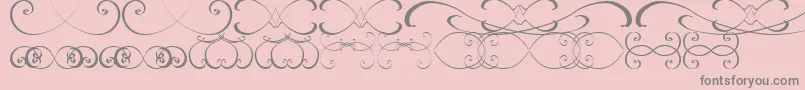 OrnamentsssTfb-Schriftart – Graue Schriften auf rosa Hintergrund