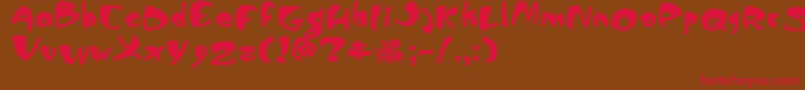 フォントPiranhasexual – 赤い文字が茶色の背景にあります。