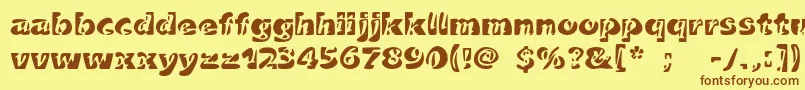 フォントDuettoc – 茶色の文字が黄色の背景にあります。