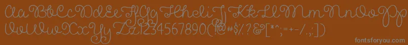 PrettyGirlsScriptDemo-Schriftart – Graue Schriften auf braunem Hintergrund