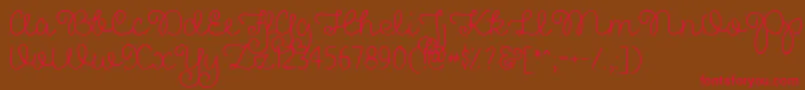 フォントPrettyGirlsScriptDemo – 赤い文字が茶色の背景にあります。