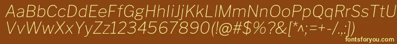 LibrefranklinThinitalic-fontti – keltaiset fontit ruskealla taustalla