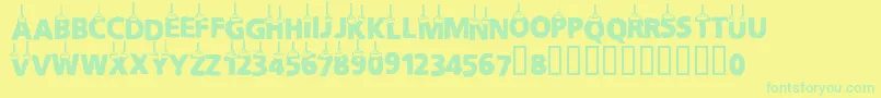Cfchritsmasletters Font – Green Fonts on Yellow Background