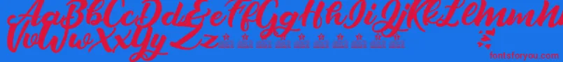 LoverArtefactsPersonalUse Font – Red Fonts on Blue Background