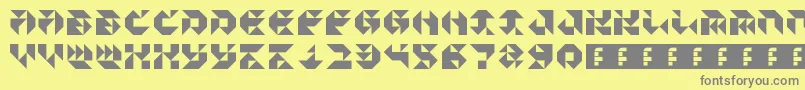 フォントParticulatorIii – 黄色の背景に灰色の文字
