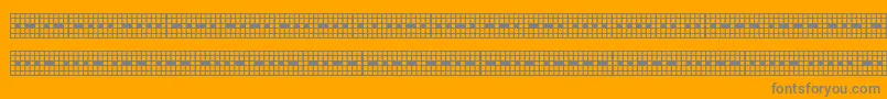 Picmor-fontti – harmaat kirjasimet oranssilla taustalla