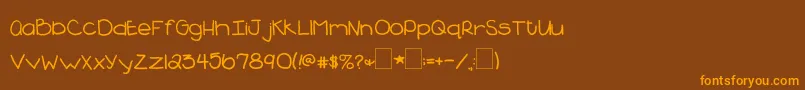 フォント2peasBlueberryPie – オレンジ色の文字が茶色の背景にあります。