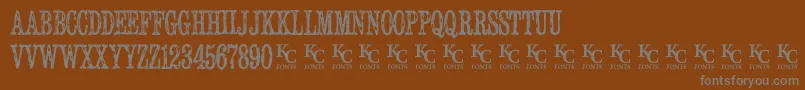 Serialpublicationdemo-fontti – harmaat kirjasimet ruskealla taustalla