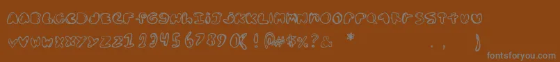 Шрифт Bolddednick – серые шрифты на коричневом фоне