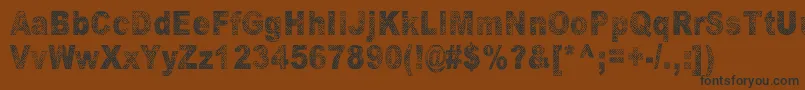 OranssiHohde Font – Black Fonts on Brown Background