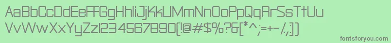 Rational-fontti – harmaat kirjasimet vihreällä taustalla