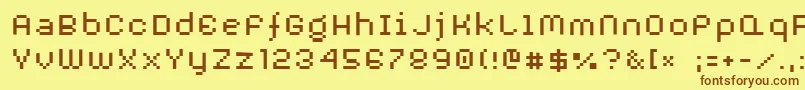 フォントAuxDotbitcXtra – 茶色の文字が黄色の背景にあります。