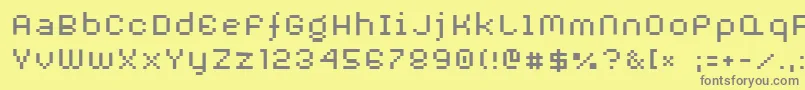 フォントAuxDotbitcXtra – 黄色の背景に灰色の文字