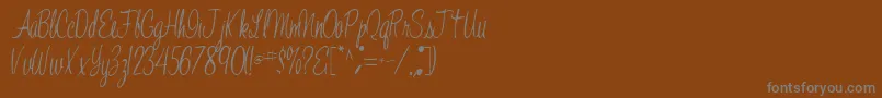 Шрифт Jelindafont52Regular – серые шрифты на коричневом фоне