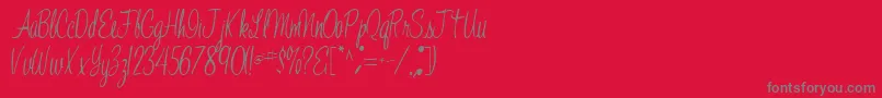 フォントJelindafont52Regular – 赤い背景に灰色の文字