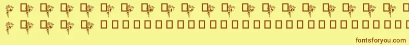 BlumenstraussCaps-fontti – ruskeat fontit keltaisella taustalla