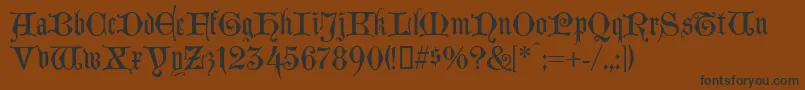 フォントLombardinaTwo – 黒い文字が茶色の背景にあります