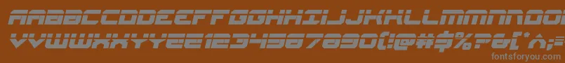 Gearheadlaserital-fontti – harmaat kirjasimet ruskealla taustalla