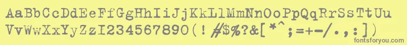 フォントTrixiec – 黄色の背景に灰色の文字