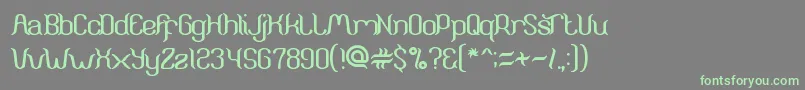 ArunaAiraJasmine-Schriftart – Grüne Schriften auf grauem Hintergrund