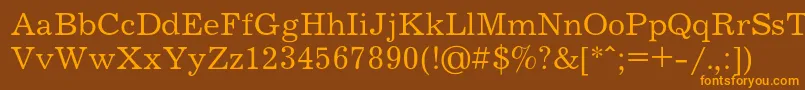 フォントJournalc – オレンジ色の文字が茶色の背景にあります。