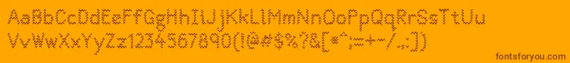 Quantumwaves0p1-Schriftart – Braune Schriften auf orangefarbenem Hintergrund