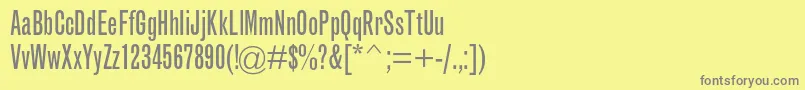 フォントGrotesquemtstdExtracond – 黄色の背景に灰色の文字