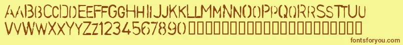 フォントStenb – 茶色の文字が黄色の背景にあります。