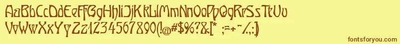 フォントOberTuerkheim – 茶色の文字が黄色の背景にあります。