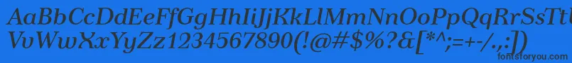 TusartextItalic Font – Black Fonts on Blue Background