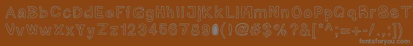 Mogghla-fontti – harmaat kirjasimet ruskealla taustalla