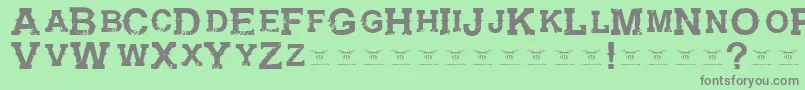 フォントGunfighteracademyRegular – 緑の背景に灰色の文字