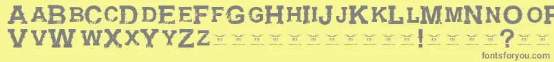 GunfighteracademyRegular-Schriftart – Graue Schriften auf gelbem Hintergrund