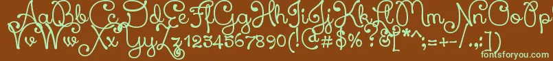 フォントXiomaraScript – 緑色の文字が茶色の背景にあります。