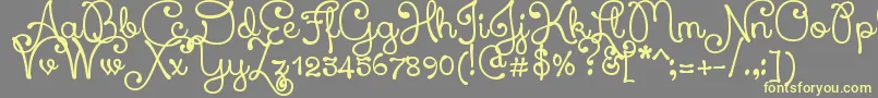 XiomaraScript Font – Yellow Fonts on Gray Background