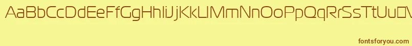 フォントCgoMagistralCyrillic – 茶色の文字が黄色の背景にあります。