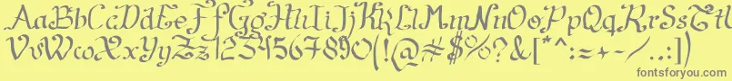 フォントArtesanР±as2011 – 黄色の背景に灰色の文字